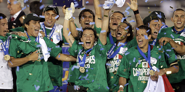 Members of the Mexico team celebrate a 4-2 win against the United States in the CONCACAF Gold Cup s...
