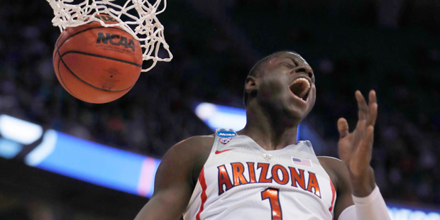 Arizona guard Rawle Alkins shouts after his dunk during the first half against North Dakota in an N...