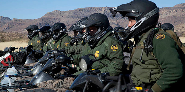 Border Patrol agents line up in formation on motor bikes in the Tucson sector. (Photo: Customs and ...