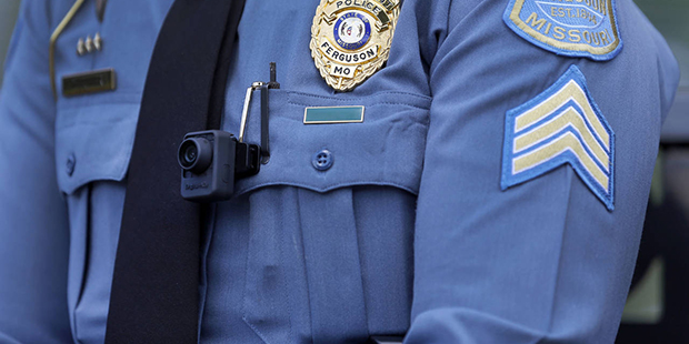 FILE - In this July 23, 2015, file photo, Ferguson police Sgt. Dominica Fuller wears a body camera ...