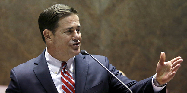 In this Jan. 11, 2016, file photo, Arizona Republican Gov. Doug Ducey presents his State of the Sta...