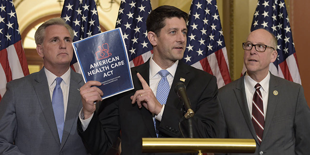 House Speaker Paul Ryan of Wis., center, standing with Energy and Commerce Committee Chairman Greg ...