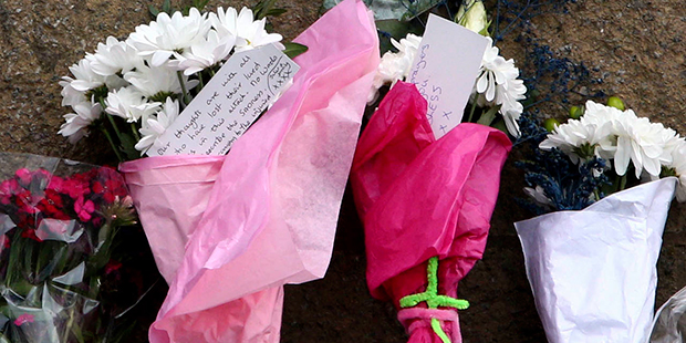 Tributes are seen outside the Manchester Arena in Manchester, England, Wednesday, May 24, 2017. Bri...