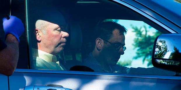 Republican candidate for Montana's only U.S. House seat, Greg Gianforte, sits in a vehicle near a D...