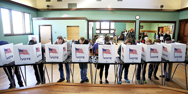 Voters cast their ballots at the Wil-Mar Neighborhood Center on the Near East Side of Madison, Wis....