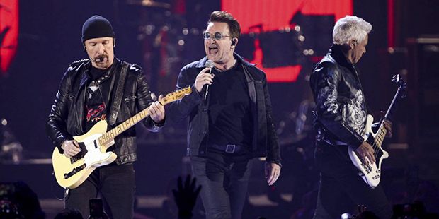 FILE - In this Sept. 23, 2016 file photo, The Edge, from left, Bono and Adam Clayton of the music g...