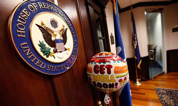 A balloon and card from the office of Sen. Bill Cassidy, R-La., is seen tied to the door of the clo...