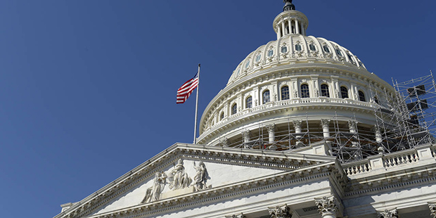 FILE -- In this Sept. 6, 2016 file photo, an American flag flies over Capitol Hill in Washington. (...