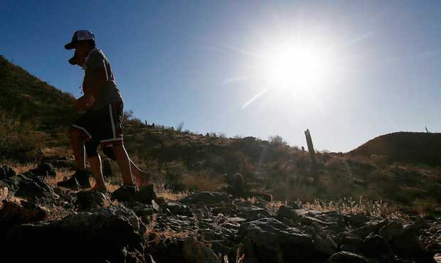 Hikers brave the afternoon sun as the temperatures hit 110-degrees Thursday, June 15, 2017, in Phoe...