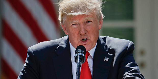 President Donald Trump speaks about the U.S. role in the Paris climate change accord, Thursday, Jun...