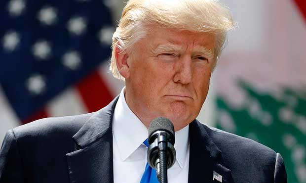 President Donald Trump listens to a question during a joint news conference with Lebanese Prime Min...