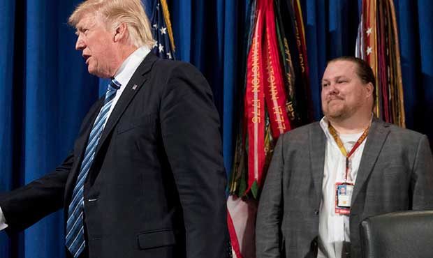 President Donald Trump is greeted by Veterans Affairs Secretary David Shulkin, left, as he arrives ...