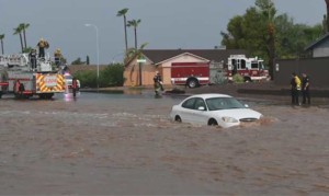 Crews rescue driver stranded in flooded Phoenix-area wash
