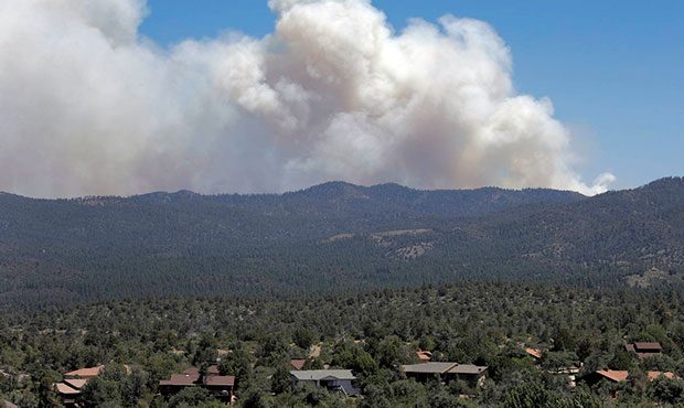 A wildfire burns near Mayer, Ariz, Wednesday, June 28, 2017, as seen from Prescott Valley, Ariz. Th...