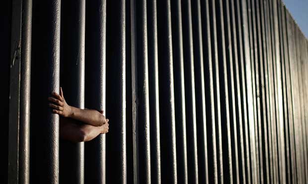 FILE - In this June 13, 2013, file photo, hands from Daniel Zambrano of Tijuana, Mexico, hold on to...
