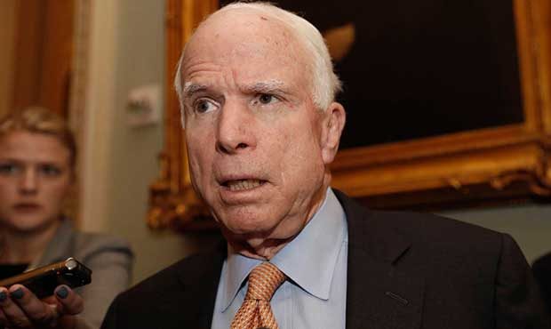 Sen. John McCain, R-Ariz. listens to a reporter's question before a policy luncheon on Capitol Hill...