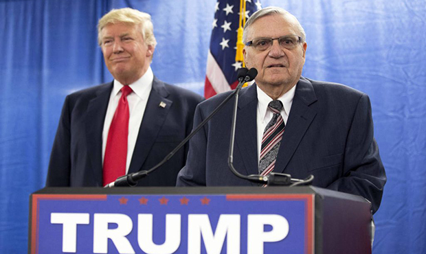 FILE - In this Jan. 26, 2016 file photo, Republican presidential candidate Donald Trump, left, is j...