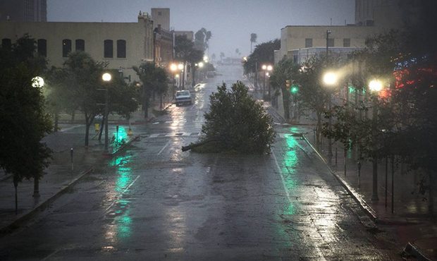 A tree blocks a street as Hurricane Harvey makes landfall in Corpus Christi, Texas, on Friday, Aug....