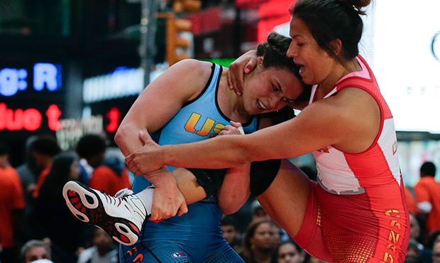 FILE - In this May 19, 2016, file photo, Adeline Gray, left, attempts to take down Canada's Justina...