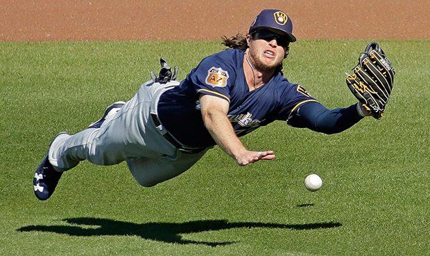 Milwaukee Brewers right fielder Brett Phillips dives for but misses a double by Seattle Mariners' N...