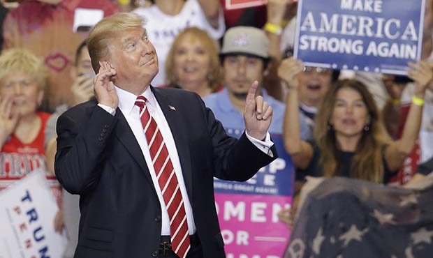 President Donald Trump speaks at a rally at the Phoenix Convention Center, Tuesday, Aug. 22, 2017, ...
