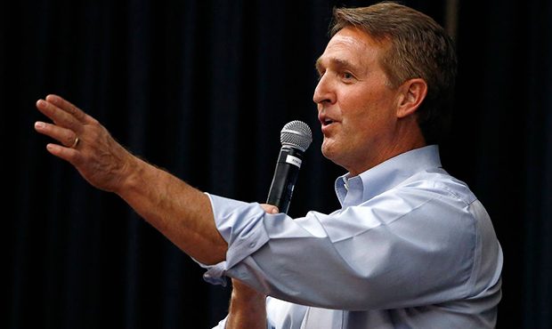 FILE- In this April 13, 2017, file photo, Arizona Republican Sen. Jeff Flake takes a question from ...