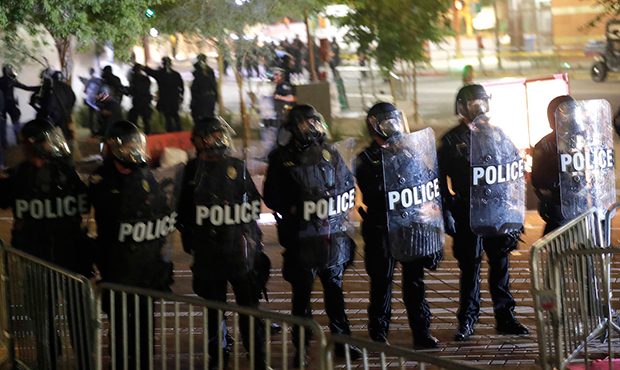 Phoenix police move protesters away after using tear gas outside the Phoenix Convention Center, Tue...
