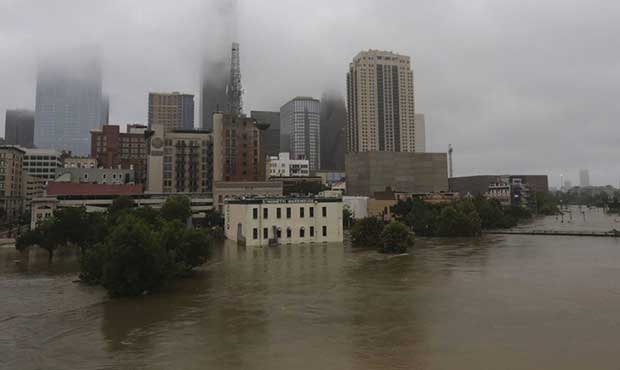 Floodwaters from Tropical Storm Harvey flow in the Buffalo Bayou in downtown Houston, Texas, Monday...