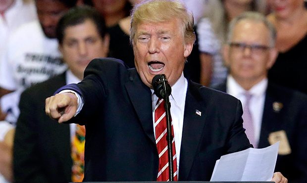 President Donald Trump speaks at a rally at the Phoenix Convention Center, Tuesday, Aug. 22, 2017, ...