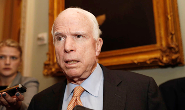 Sen. John McCain, R-Ariz. listens to a reporter's question before a policy luncheon on Capitol Hill...
