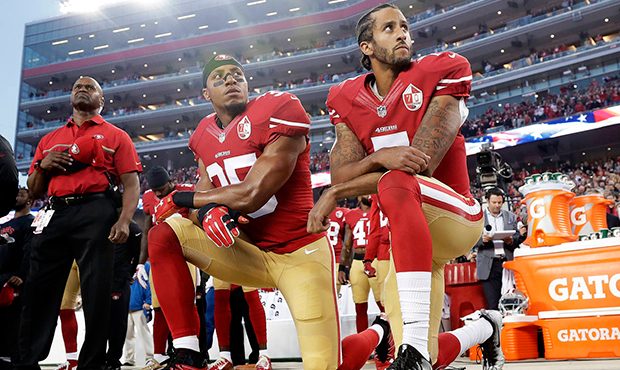 FILE - Int his Monday, Sept. 12, 2016, file photo, San Francisco 49ers safety Eric Reid (35) and qu...