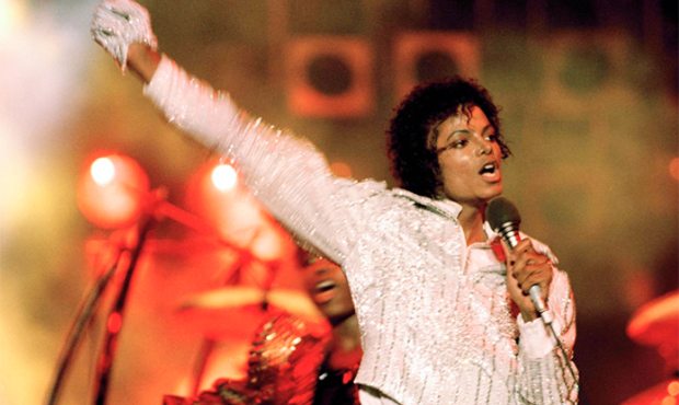 FILE - In this July 1984 file photo, Michael Jackson performs during the "Victory Tour." Julien's A...