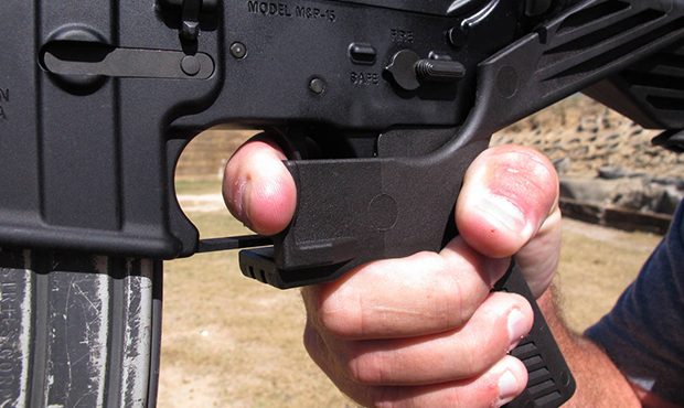 FILE - In this Oct. 4, 2017, file photo, shooting instructor Frankie McRae demonstrates the grip on...
