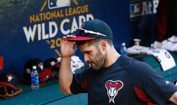 Arizona Diamondbacks right fielder J.D. Martinez walks through the dugout as he gets ready for batt...
