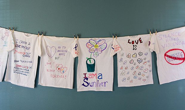 T-shirts made by domestic violence victims are displayed at the 5th Annual Domestic Violence Sympos...