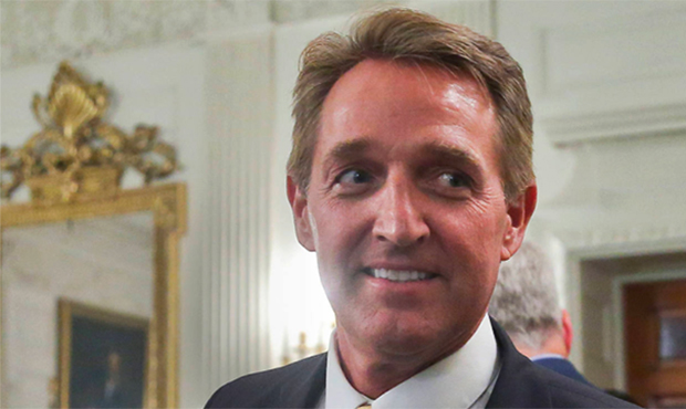 FILE - In this July 19, 2017 photo, Sen. Jeff Flake, R-Ariz. walks to his seat as he attends a lunc...