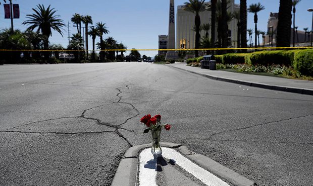 Flowers are placed near the scene of a mass shooting Monday, Oct. 2, 2017, that occurred at a music...