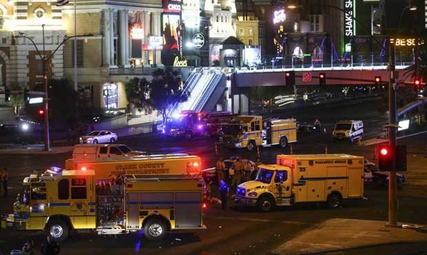 Las Vegas police and emergency vehicles sit on scene following a deadly shooting at a music festiva...
