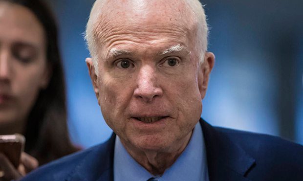 Sen John McCain, R-Ariz., chairman of the Senate Armed Services Committee, returns to his office af...