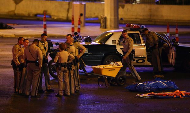 Las Vegas police gather following a deadly shooter at a music festival Monday, Oct. 2, 2017, in Las...