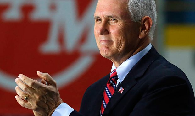 Vice President Mike Pence claps during his address at American Axle & Manufacturing in Auburn Hills...