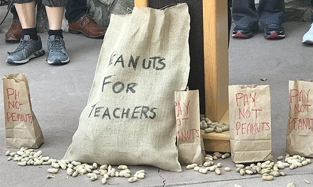Teachers came together Monday outside Gov. Doug Ducey’s office asking for teachers to get a pay r...
