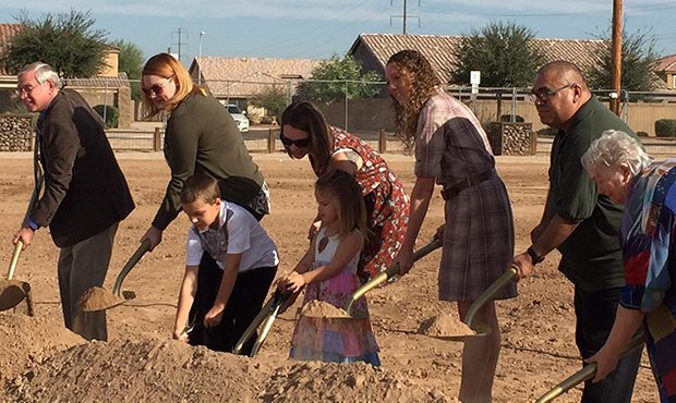 Kristen Glasser and her two children help break ground on the David Glasser Athletic Complex in Lav...