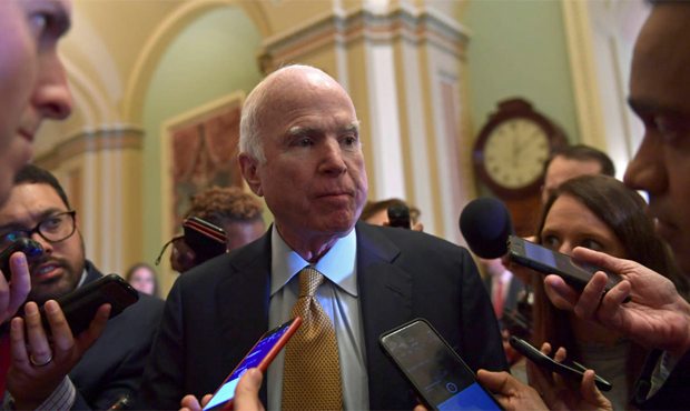 Sen. John McCain, R-Ariz., speaks to reporters following the weekly Republican policy luncheon on C...