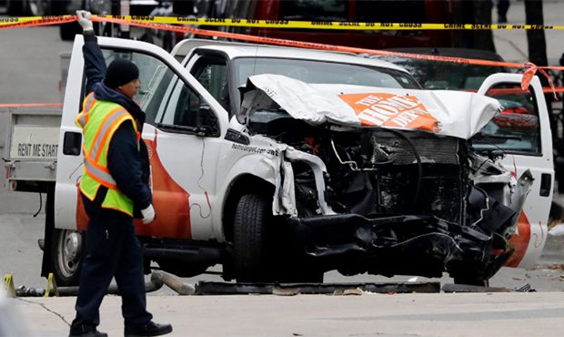 A damaged Home Depot truck remains on the scene Wednesday, Nov. 1, 2017, after the driver mowed dow...