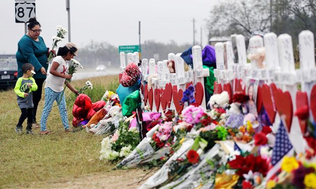 Christina Osborn and her children Alexander Osborn and Bella Araiza visit a makeshift memorial for ...