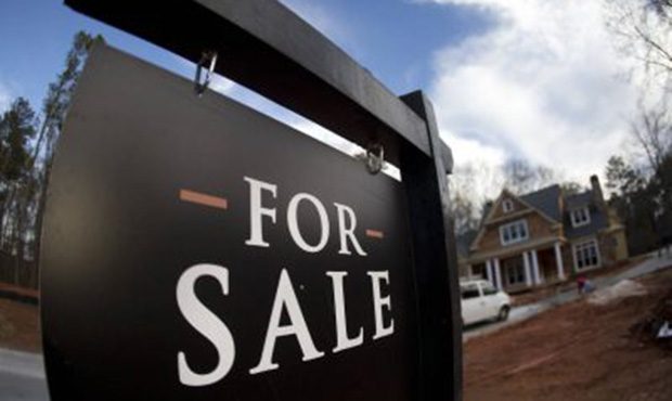 FILE – In this Thursday, Dec. 3, 2015, file photo, a home under construction and for sale is ...