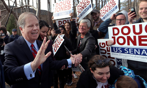 Democratic candidate Doug Jones greets supporters after casting his ballot Tuesday, Dec. 12, 2017, ...