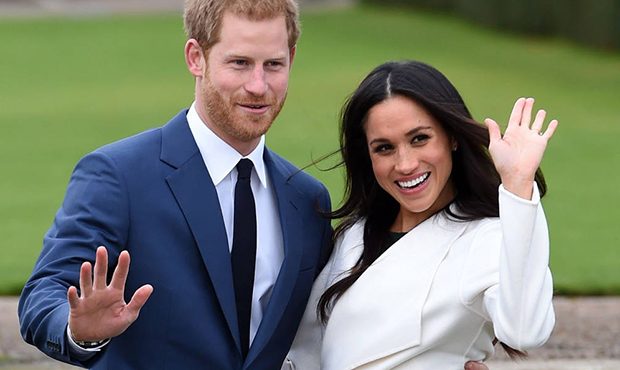 Britain's Prince Harry and Meghan Markle pose for the media in the grounds of Kensington Palace in ...