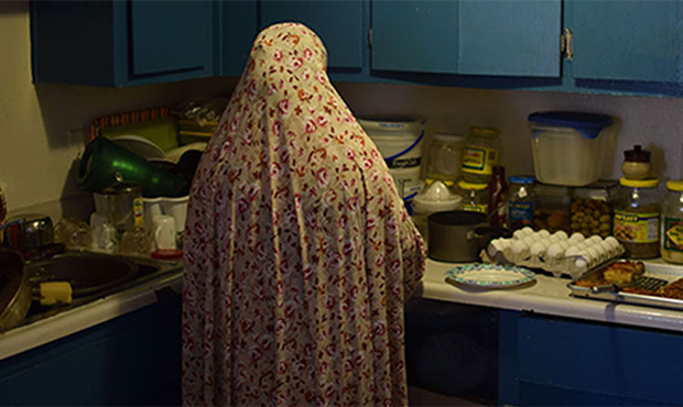 A Syrian woman, who asked not to be identified, prepares pastries. (Photo by Arren Kimbel-Sannit/Cr...